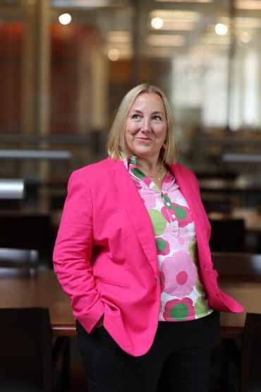 Dean Monica J. Casper in the library